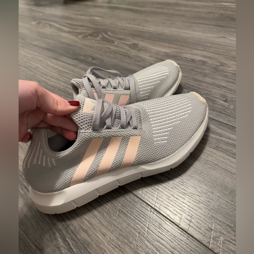 Women’s grey and pink adidas sneakers